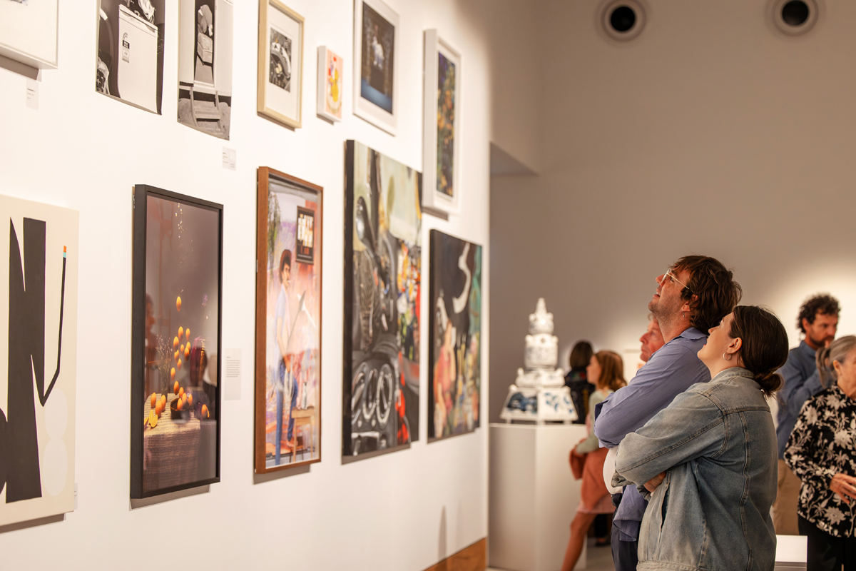 STILL 2023 Award Opening guests looking at artworks in the gallery.