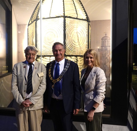 Image of Former regional lighthouse engineer Jack Duvoisin, City of Coffs Harbour Mayor Cr Paul Amos, and Cr Julie Sechi who MCed the gala opening and lighting of the Optic at the Jetty. They are standing in front of the Optic.